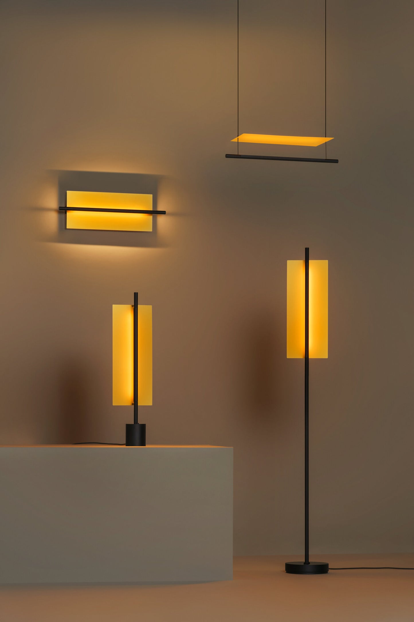 Architectural table lamp with gold finish and black metal base
