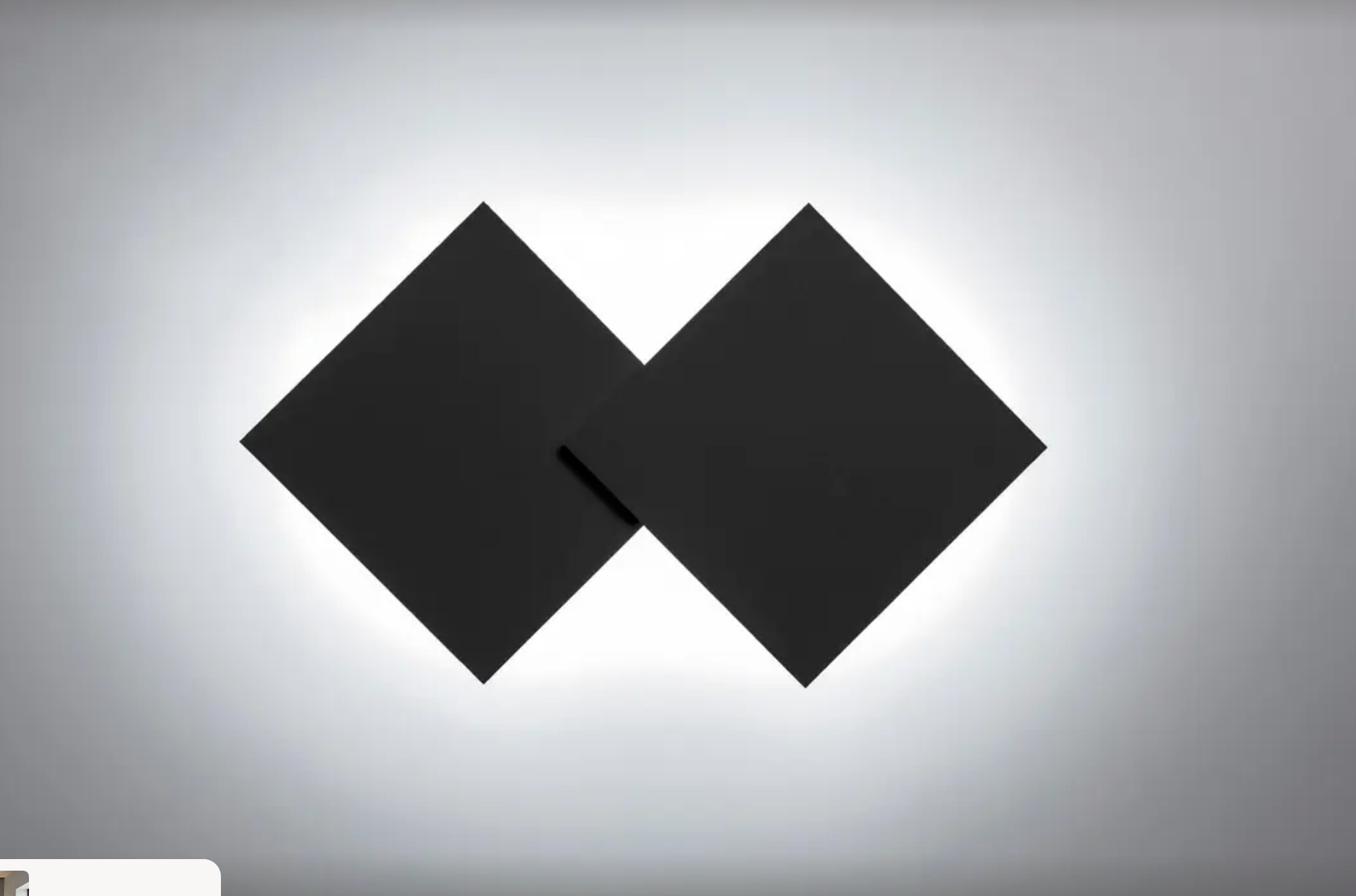 Matte black Lodes Puzzle Double Square mounted on a contemporary wall