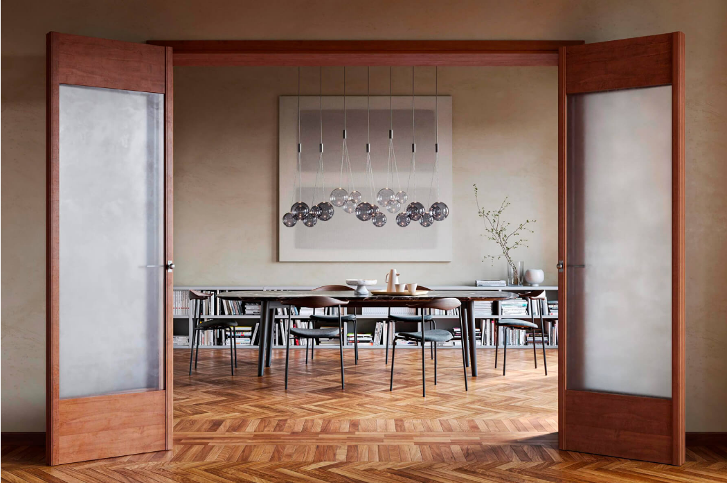 Lodes Random hanging light with smooth blown glass spheres for contemporary dining area