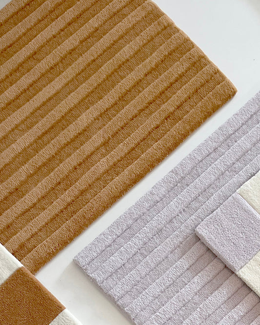 Maison Deux Solid Stripe Rug in Terra Brown – main view