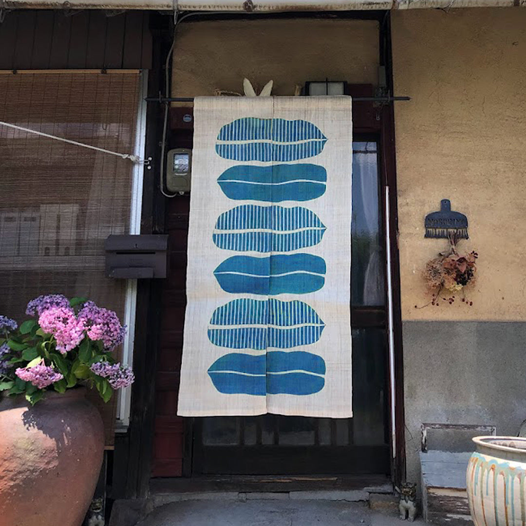 Noboriya Hand-Dyed Hemp Noren Door Curtain – Banana Leaf Blue hanging in a doorway