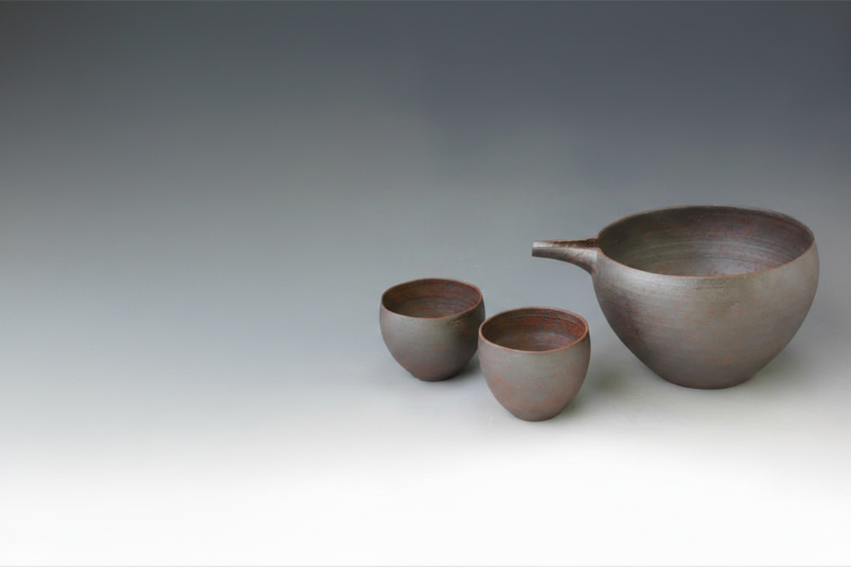 Kumagai Nanban Earthenware Sake Set, Pourer and Two Cups – set shown from a distance