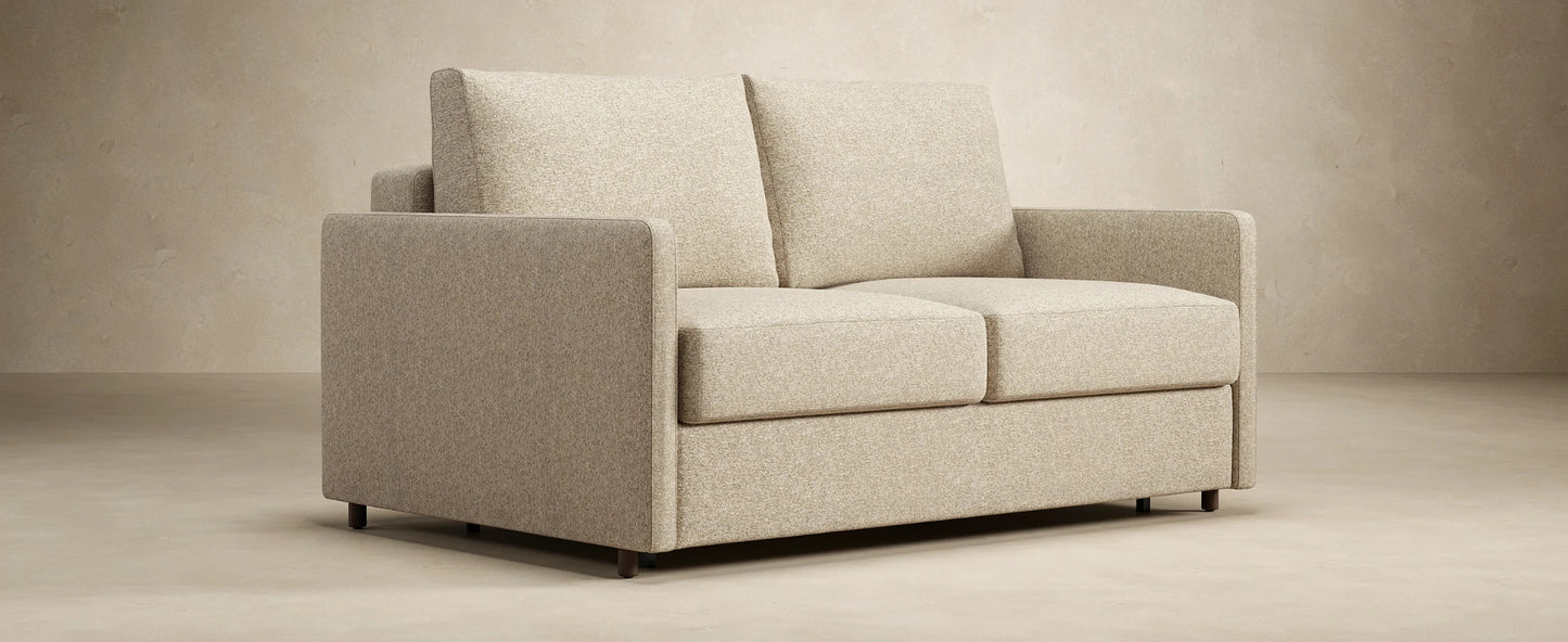 Compact full sleeper sofa with slim arms for modern interiors