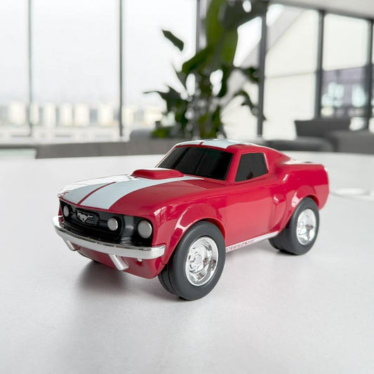 Baghera Ford Mustang racing car toy in red on the floor of a bright room
