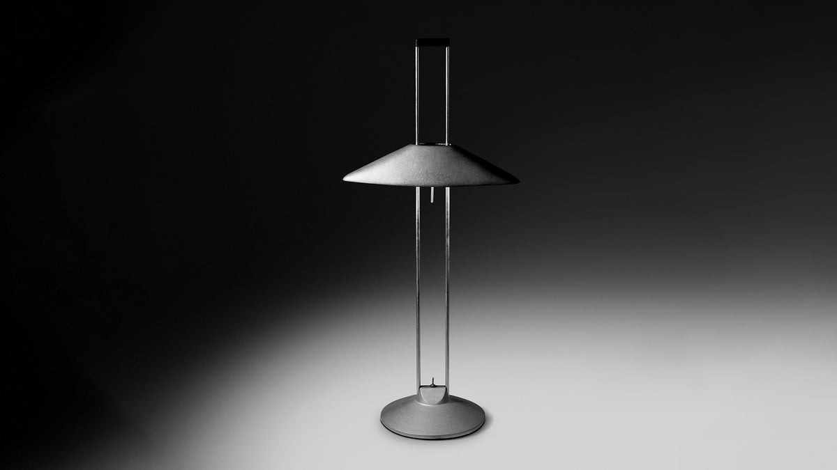 Regina T lit in a dark room, throwing indirect light onto the surface
