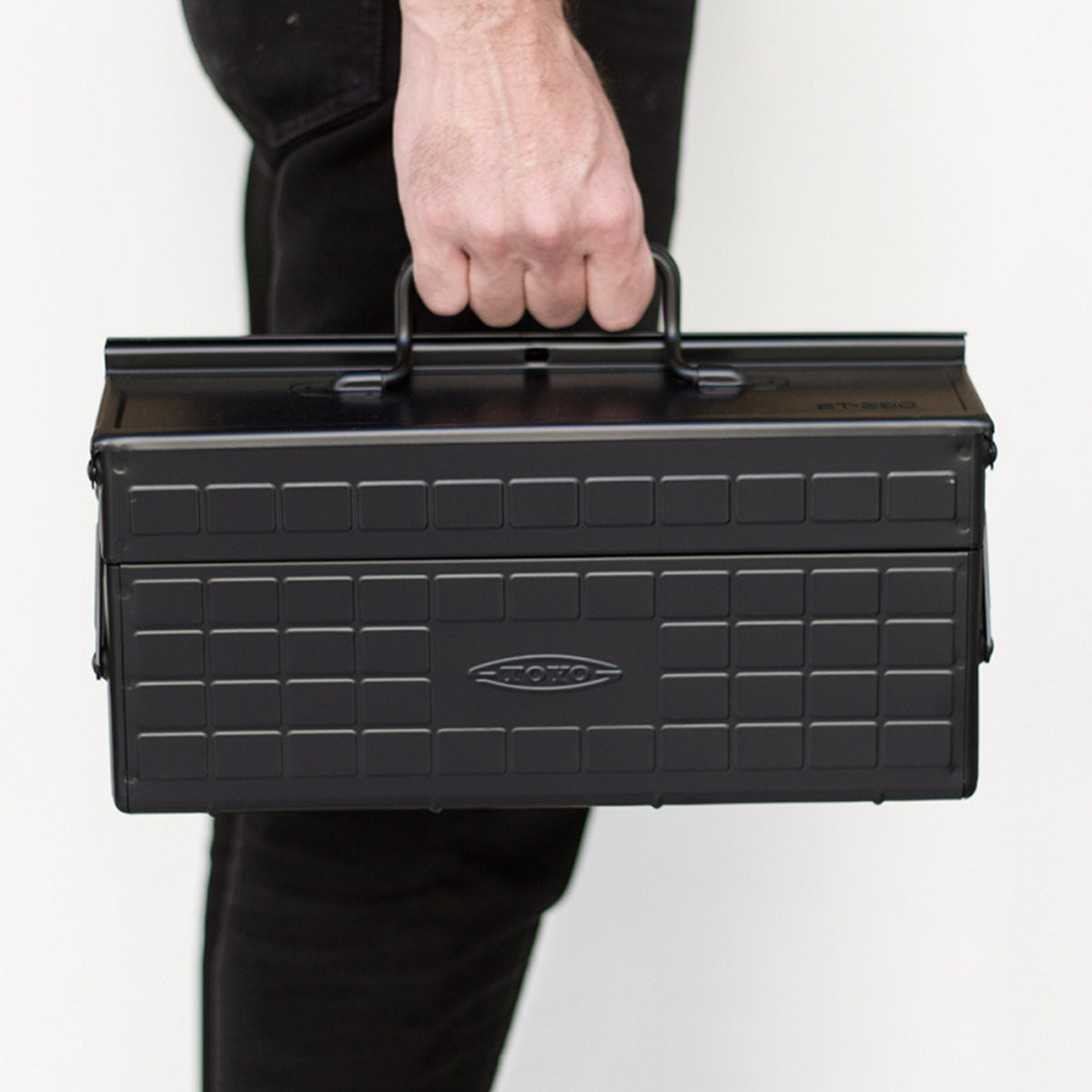 Toyo Steel ST-350 Two-Level Cantilever Toolbox – Black, carried by the handle