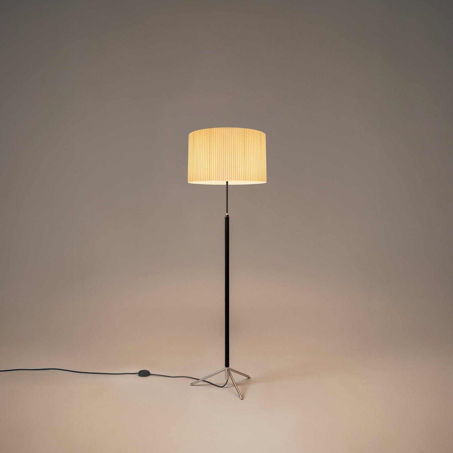 Modern floor lamp with leather-wrapped stem and chrome accents