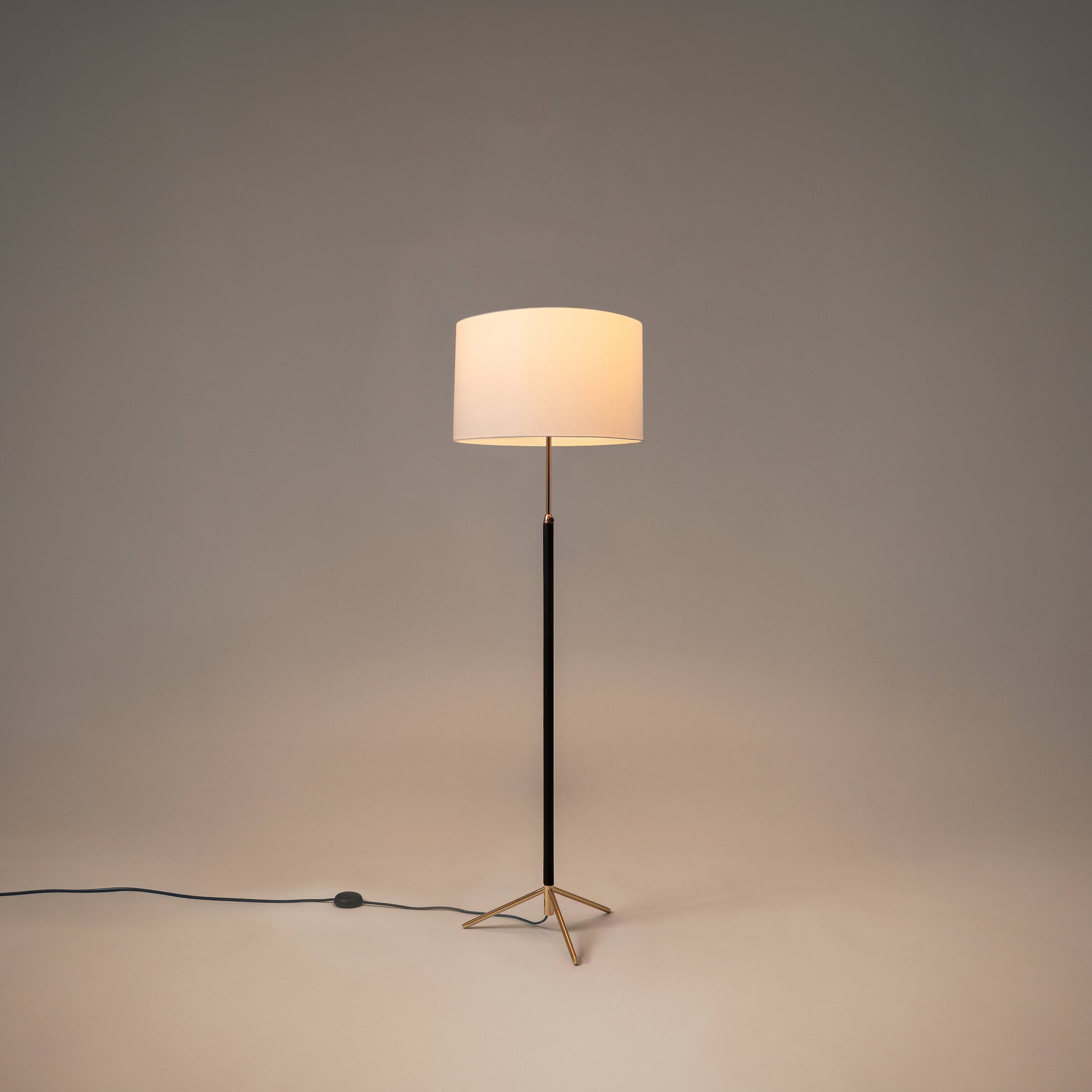 Santa & Cole Pie de Salon G2 floor lamp styled in a modern hotel suite