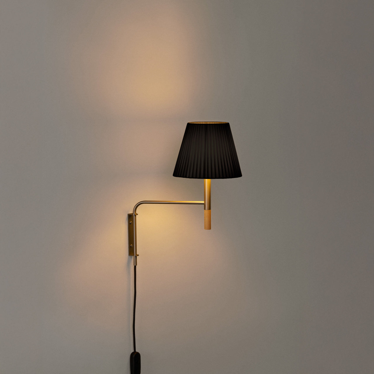 Plug-in BC wall lamp by Santa & Cole with black ribbon shade for luxury residential and hospitality spaces