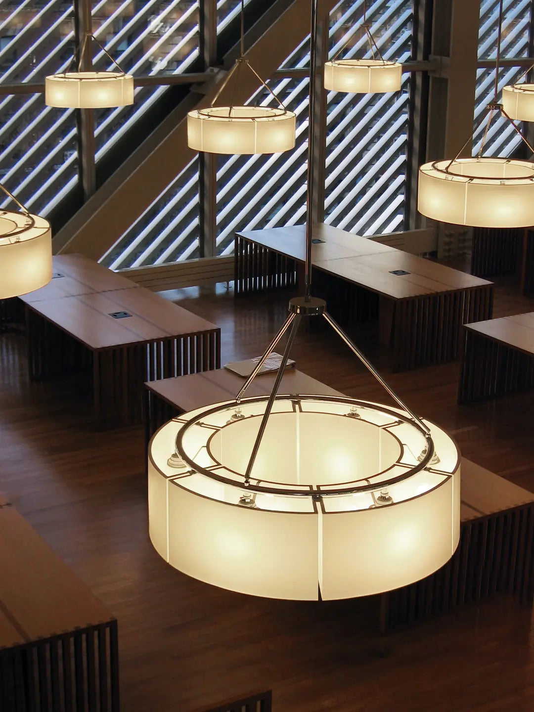 Large indoor pendant light with chrome finish and twelve shade configuration