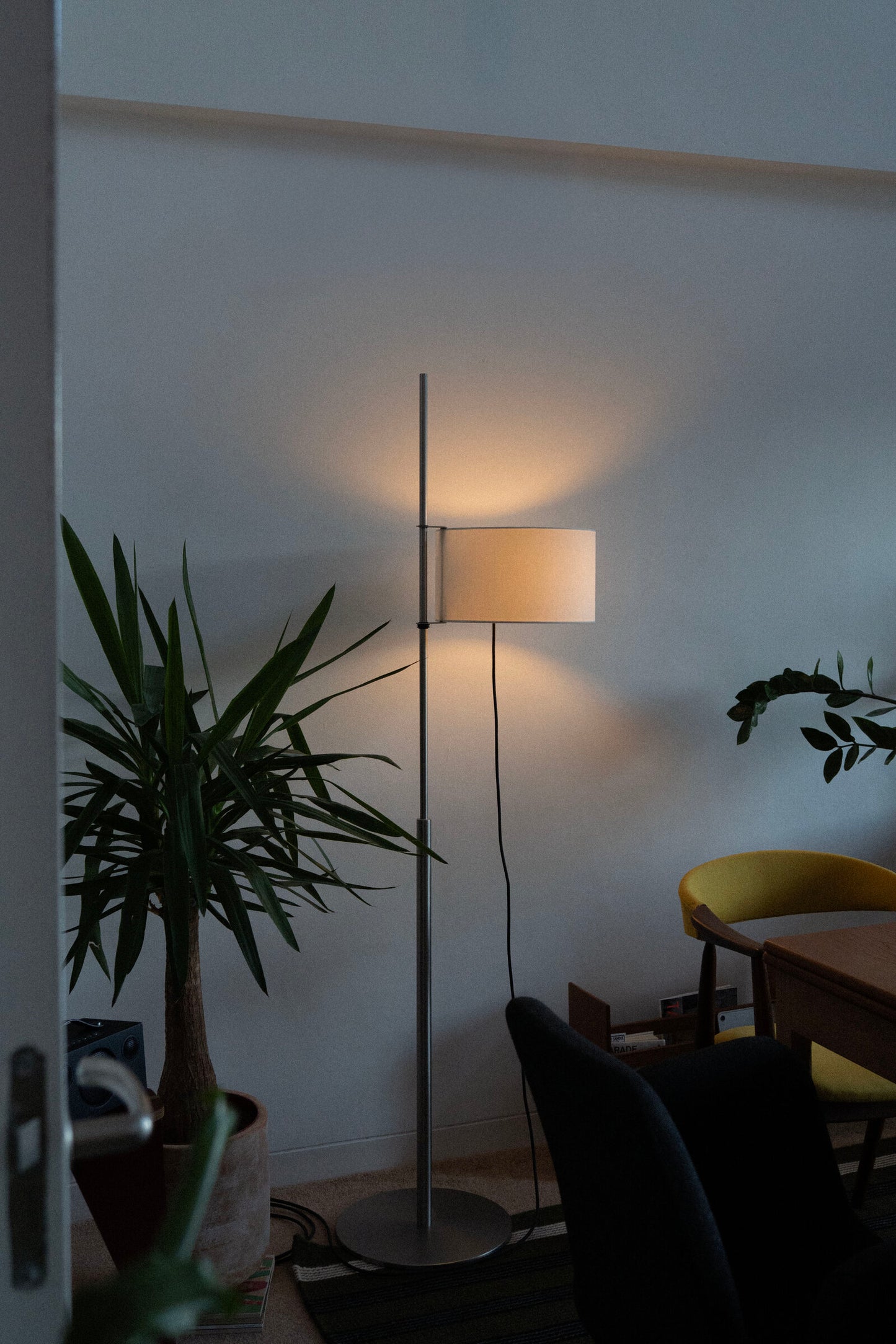 Santa & Cole TMD lamp providing soft warm light in home office