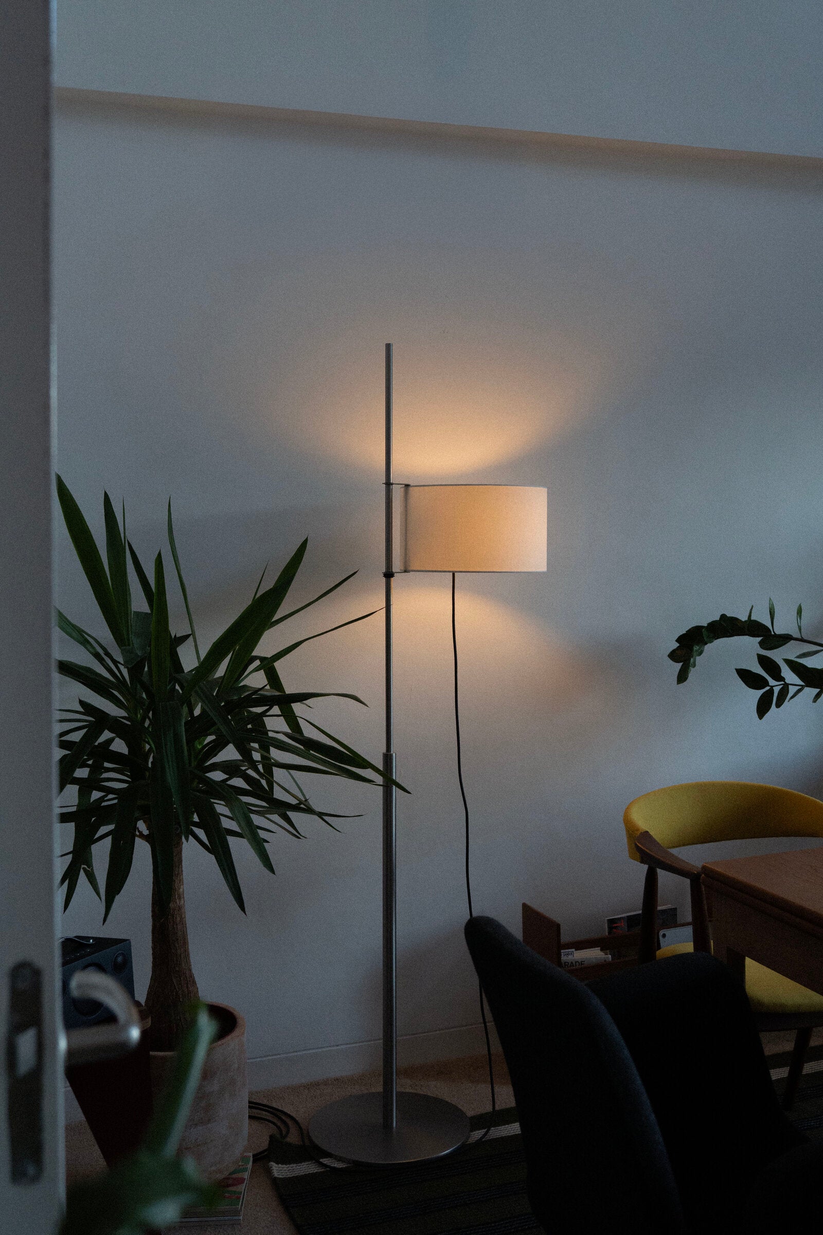 Santa & Cole TMD lamp providing soft warm light in home office