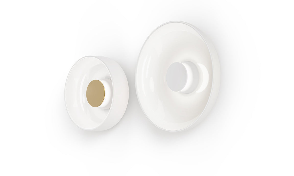 Two opal glass Totem sconces in different sizes shown side by side on white