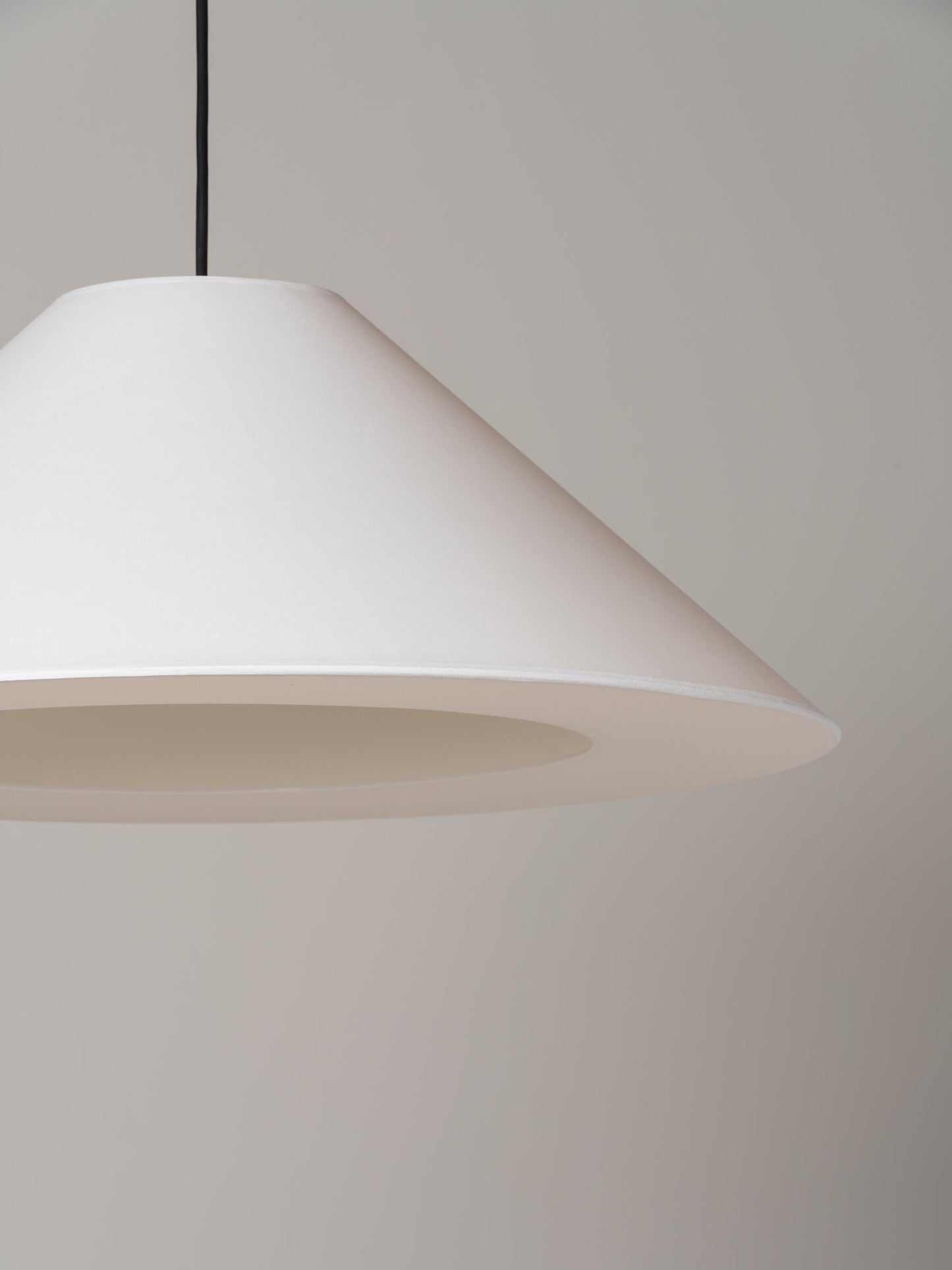Modern Spanish conical pendant lamp with soft ambient lighting
