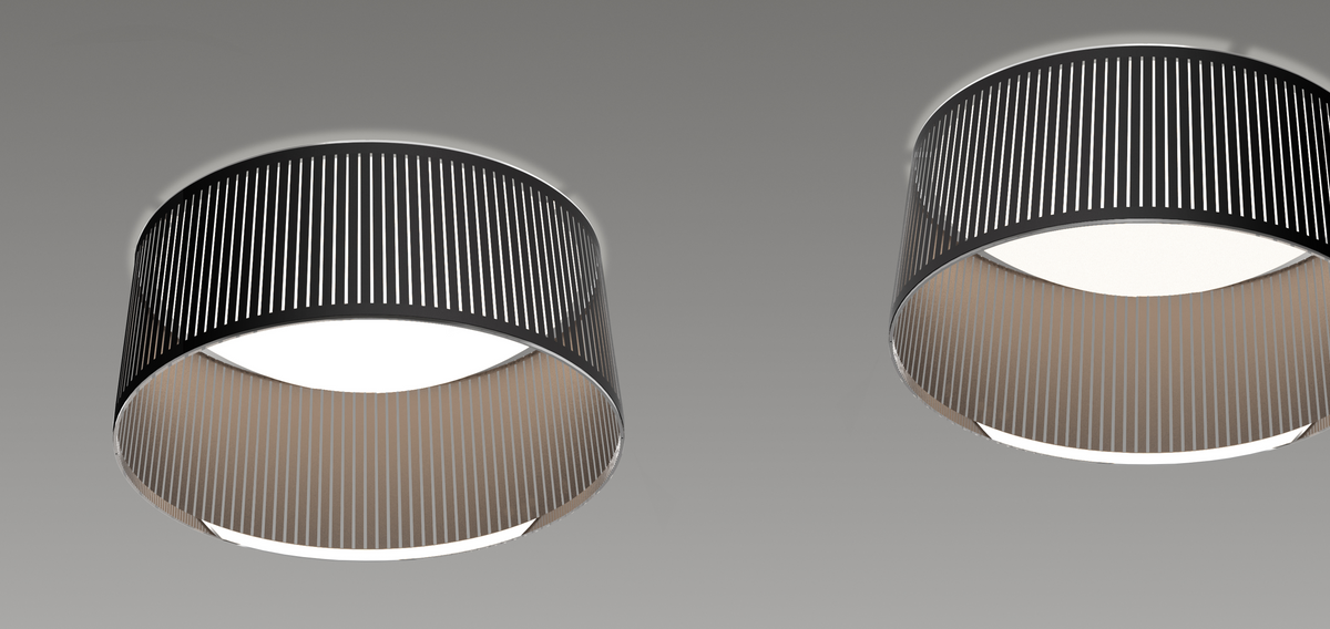 Two Solis drum flush mounts lit on a ceiling in a gray room