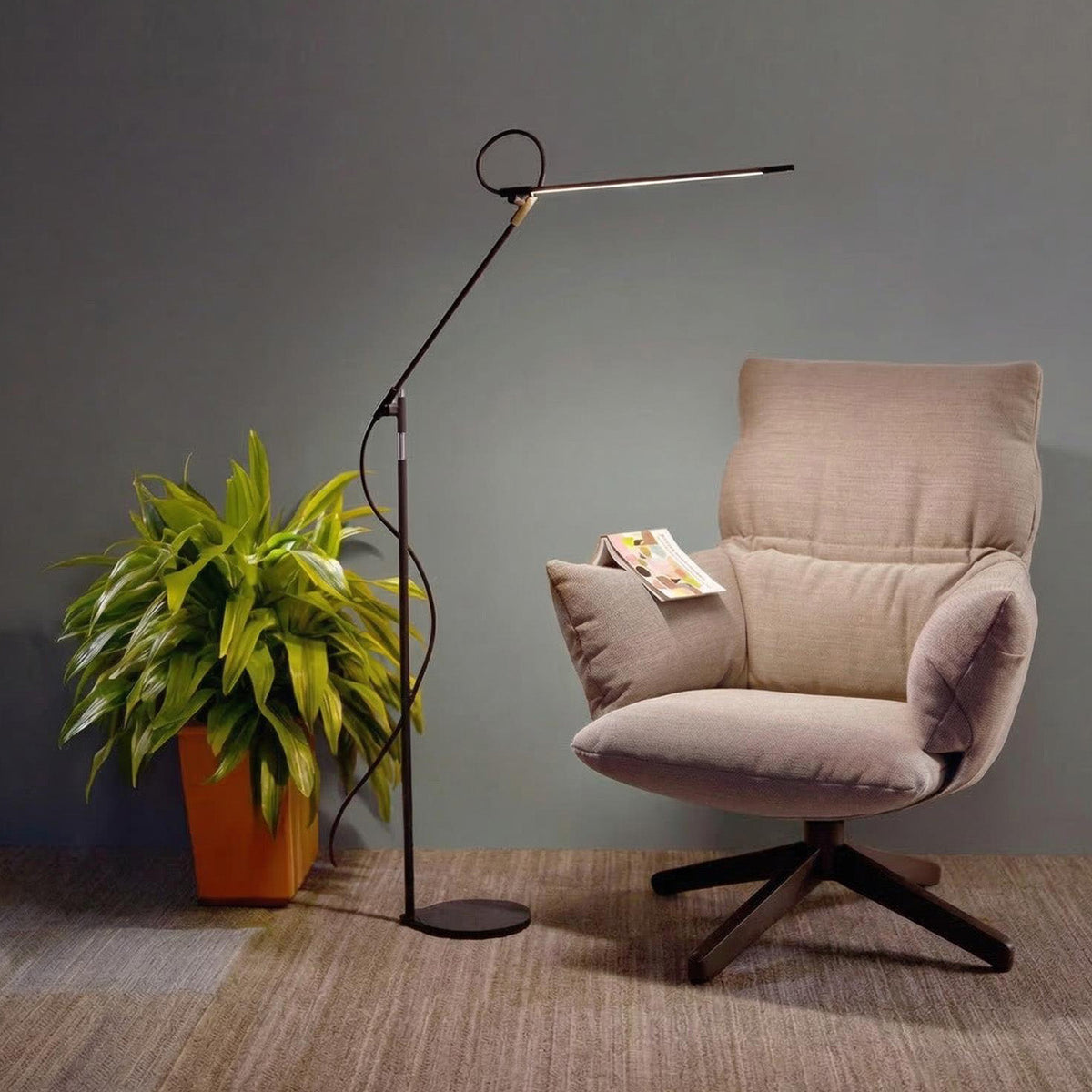 Superlight floor lamp arm angled over a seat in a furnished room, view 3
