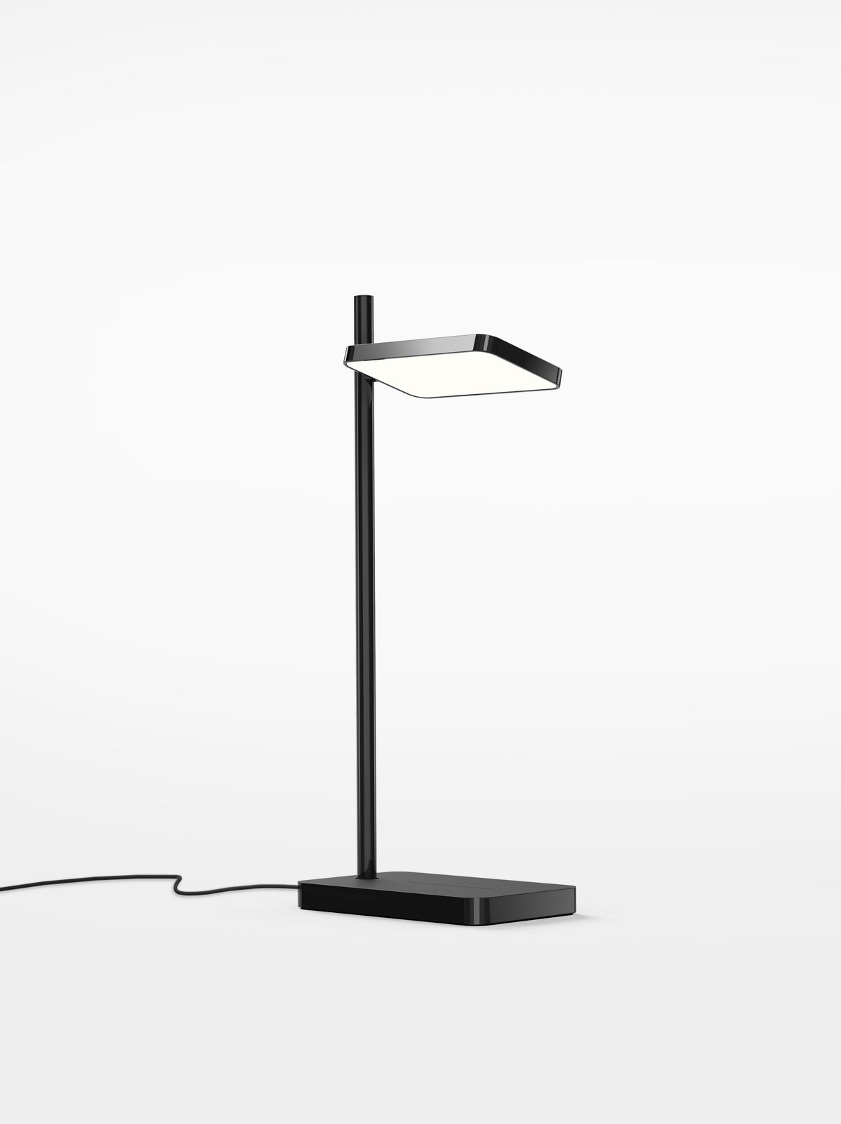 Talia desk lamp in black with wireless charging pad in the base, studio view