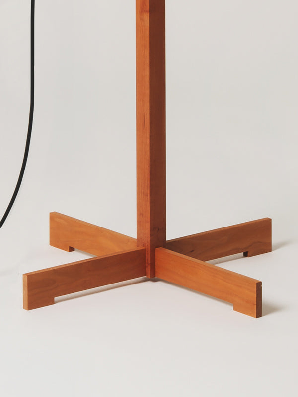 Santa & Cole TMM parchment shade floor lamp with cherry wood structure styled in luxury hotel suite