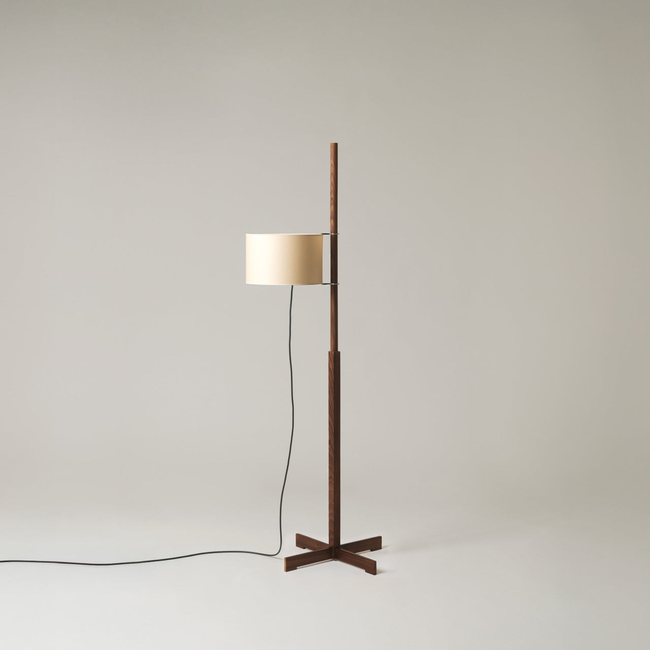 Santa & Cole TMM parchment shade floor lamp with walnut structure styled in upscale hotel suite