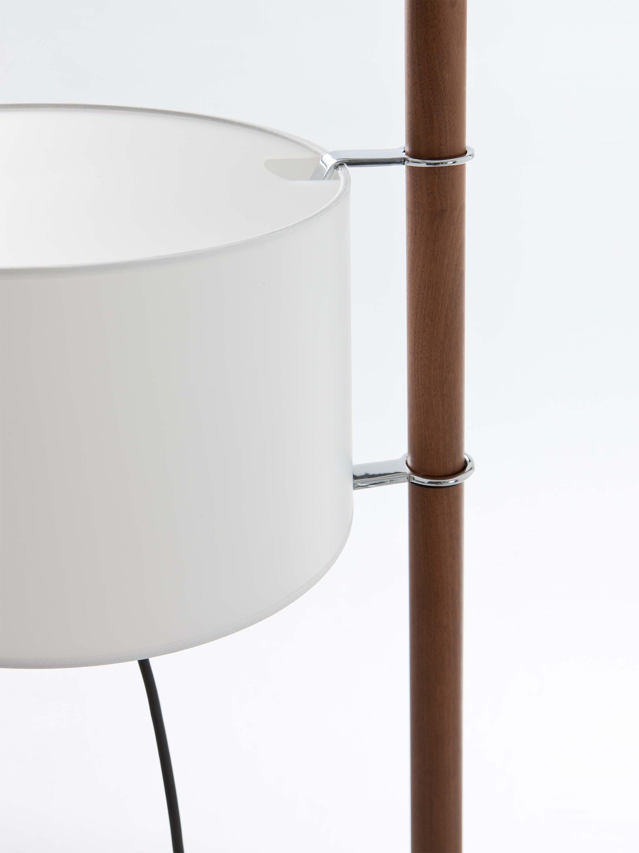 Minimalist wood floor lamp with adjustable white shade and white diffuser for modern apartment living room design