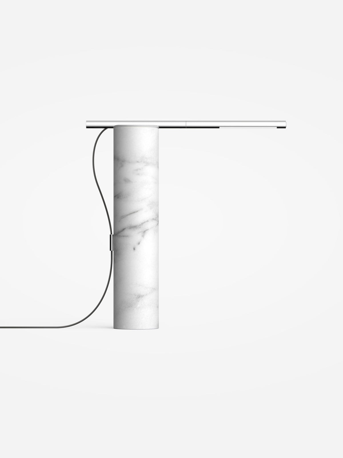 Carrara white marble base lamp with a chrome light arm, studio view
