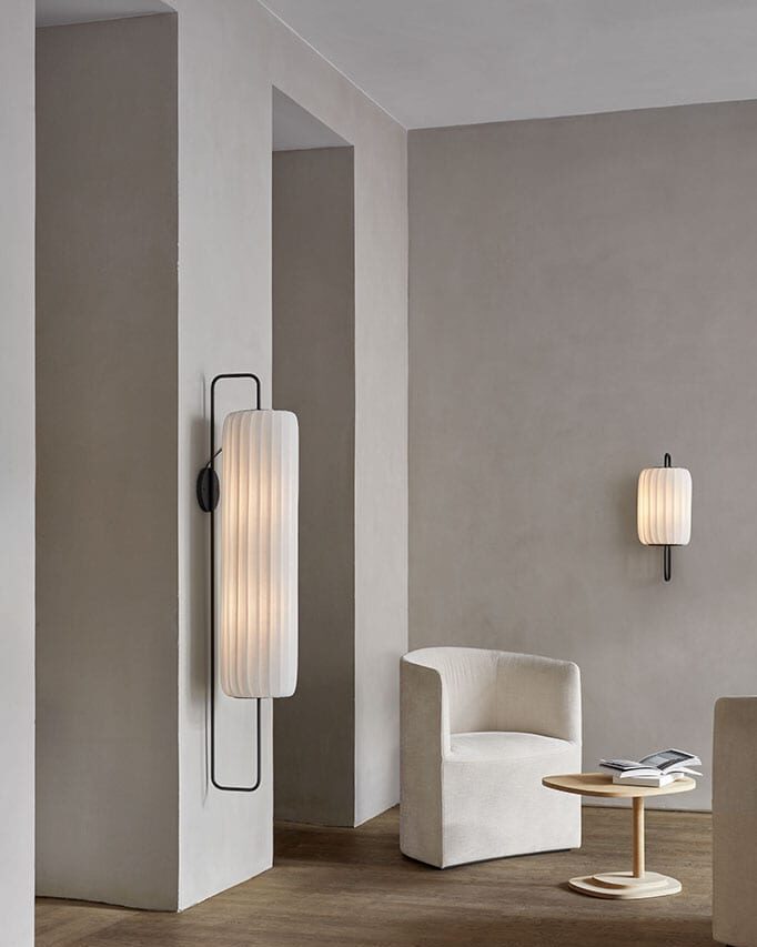 Tom Rossau TR37 wall light – lit on a wall