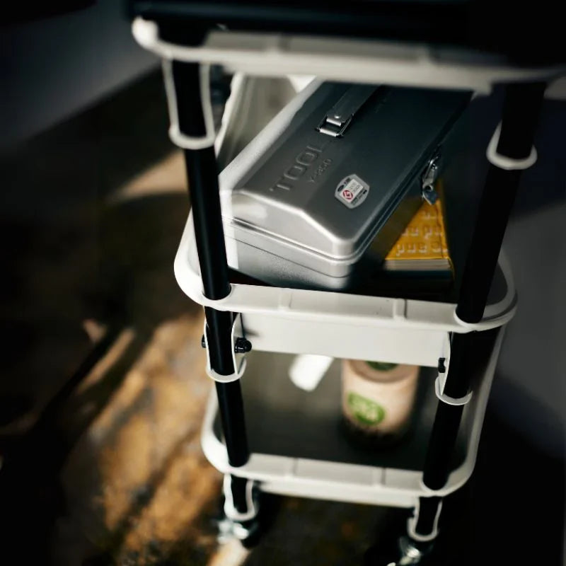 Toyo Steel TWR-4 Three-Tier Rolling Steel Cart – top shelf in moody light
