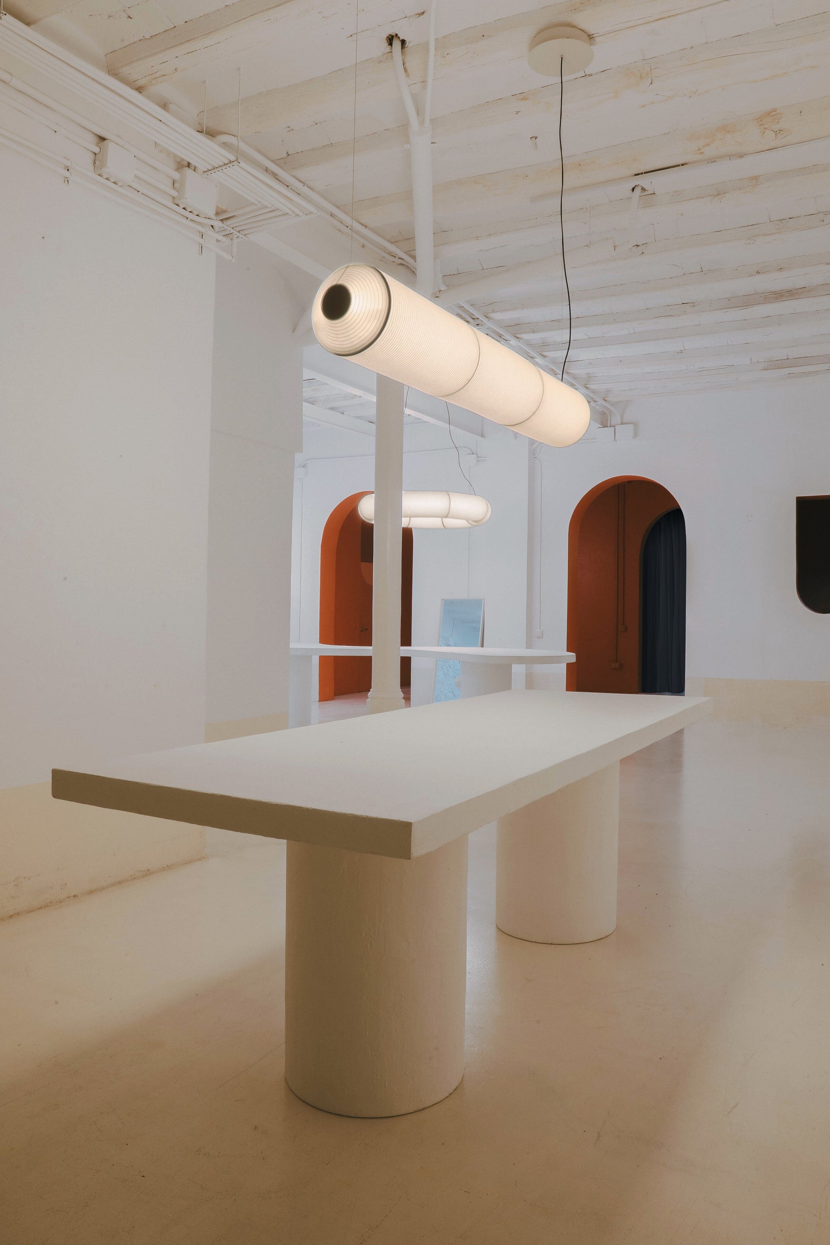 Minimalist linear hanging light fixture with warm ambient glow