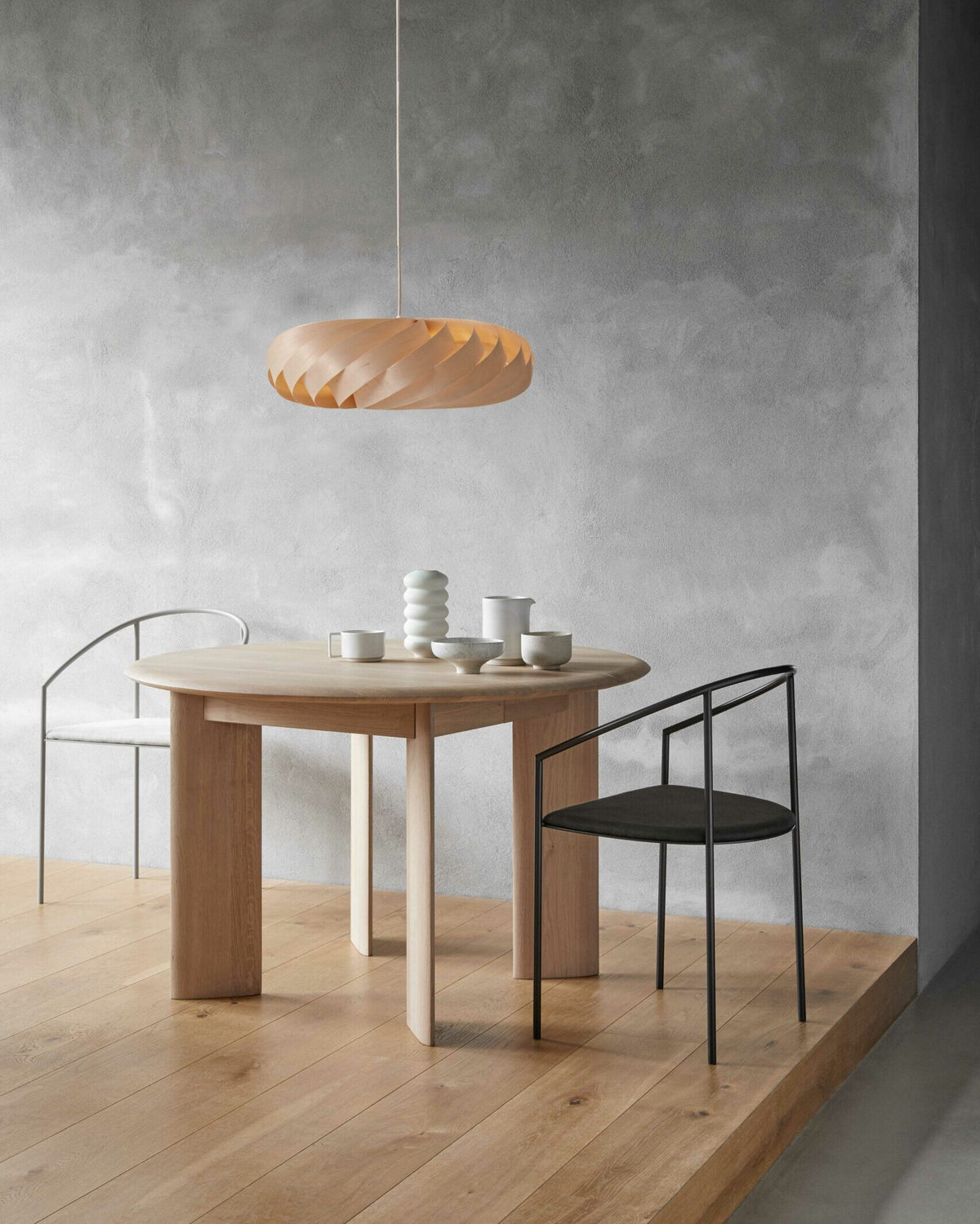 Tom Rossau TR5 pendant light – Natural Birch, lit over a dining table