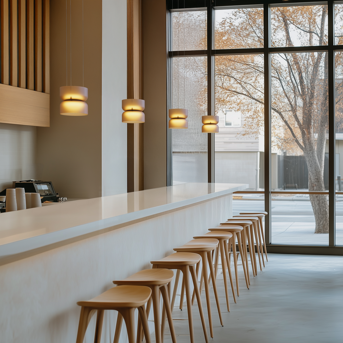 Totem Mini glass pendant installed in a furnished interior, view 1