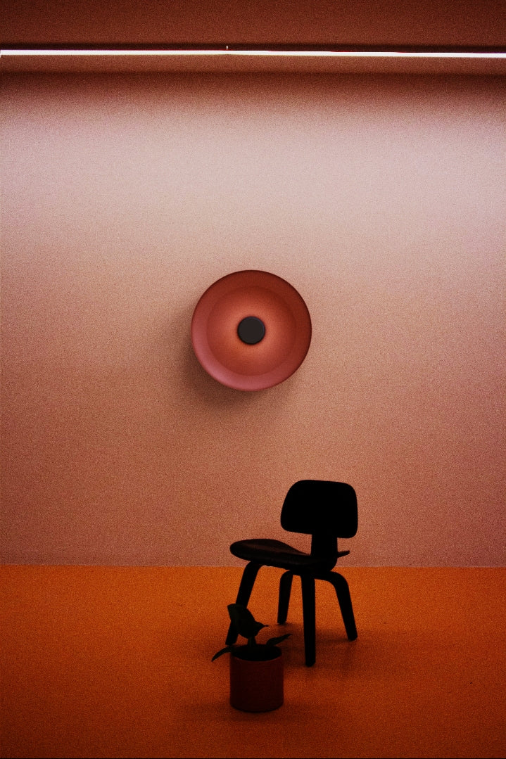 Totem metal wall light installed above furniture