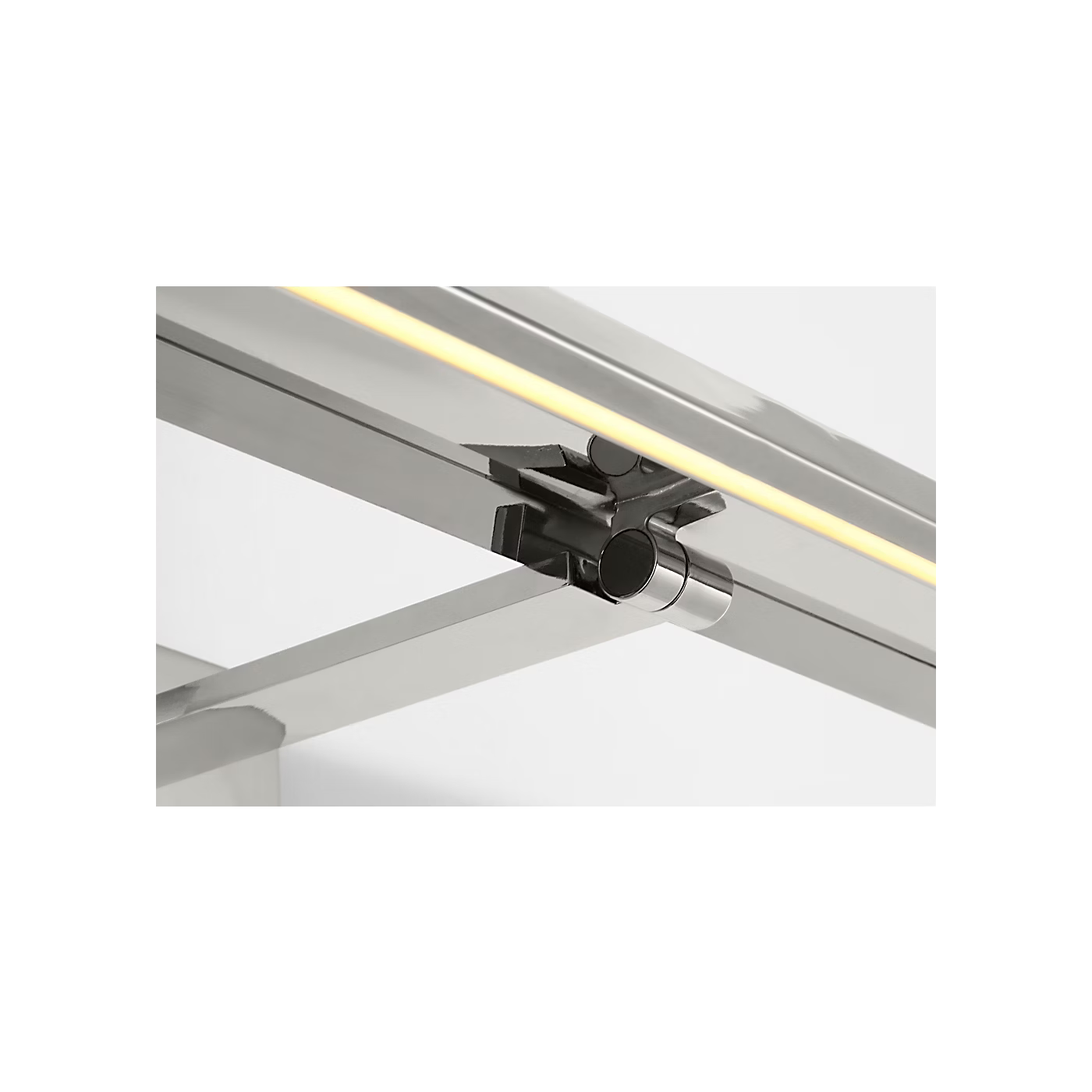 Polished nickel wall light casting warm 2700K illumination on artwork