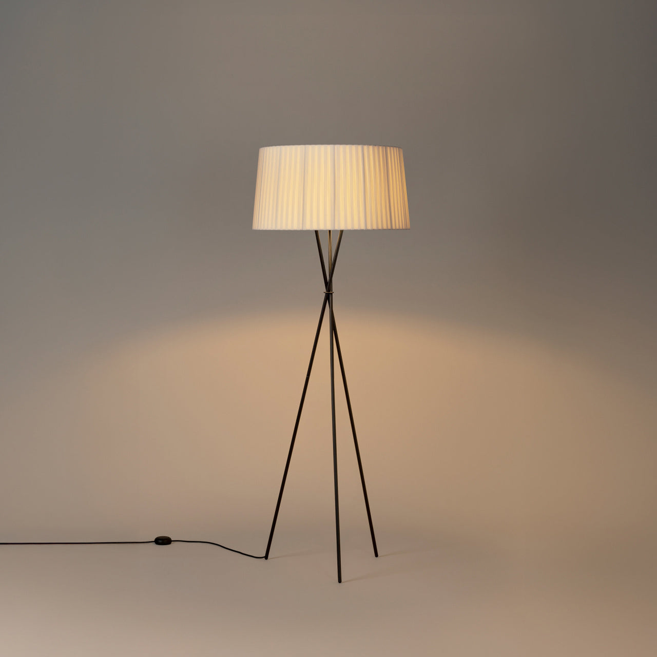 Designer tripod floor lamp with natural ribbon shade detail