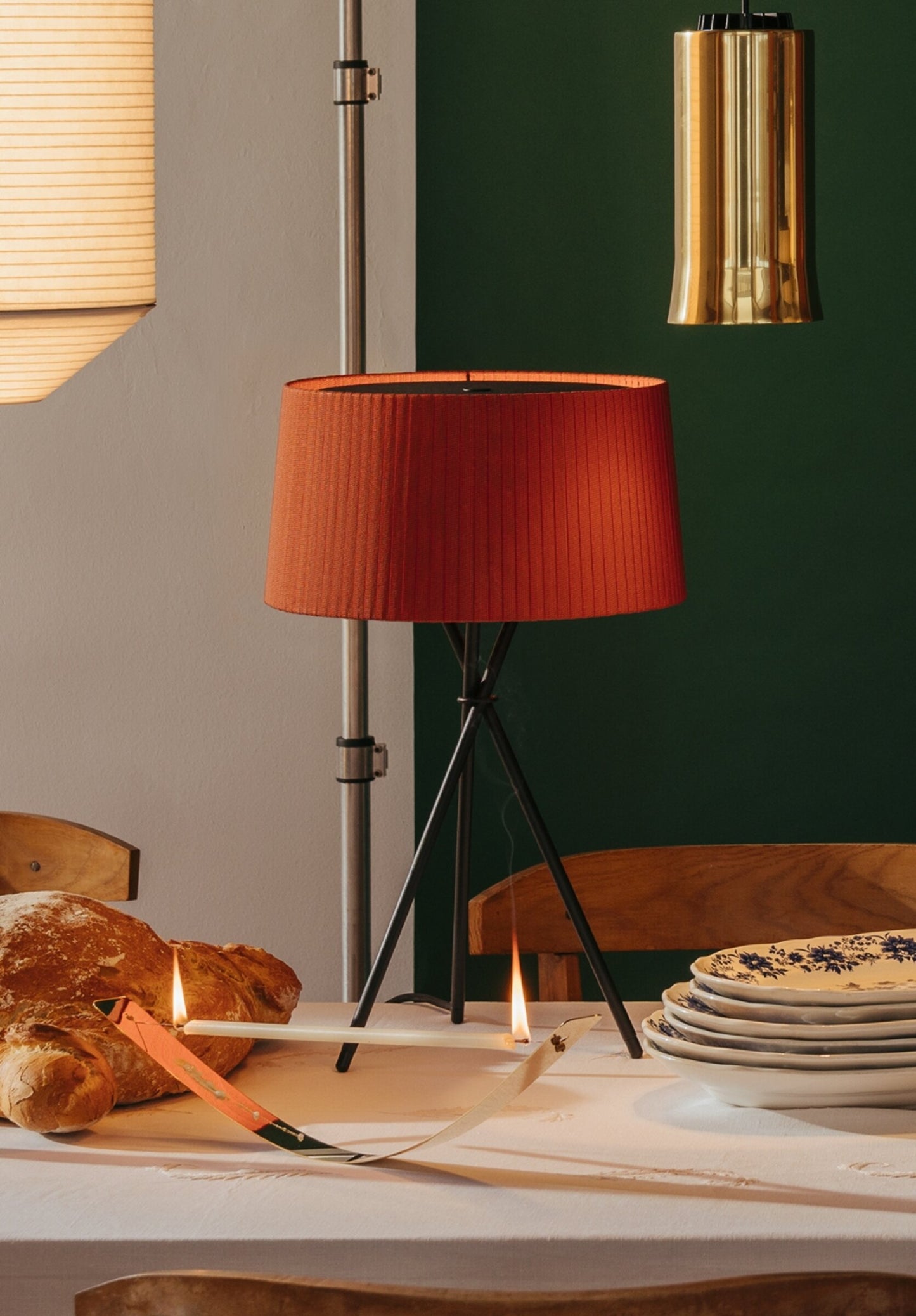 Modern indoor table lamp with warm red amber shade