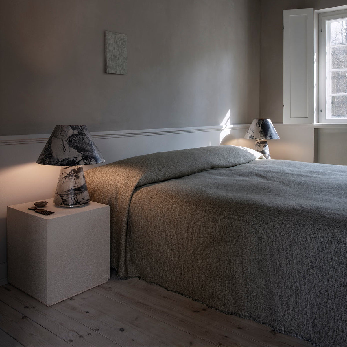 Upglas T2 by Astep — pair of black lamps beside a bed