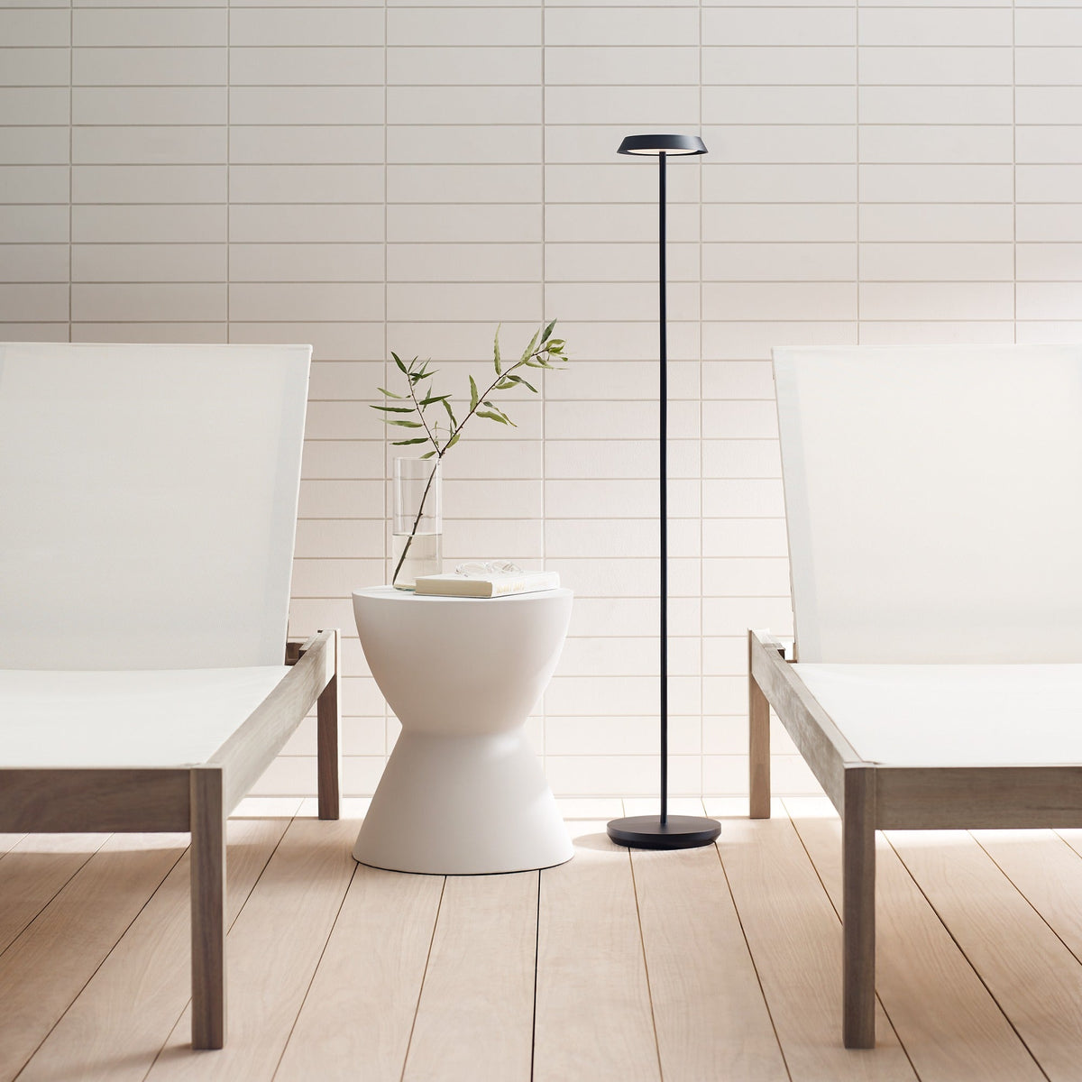 Tepa Medium floor lamp lit in a living space