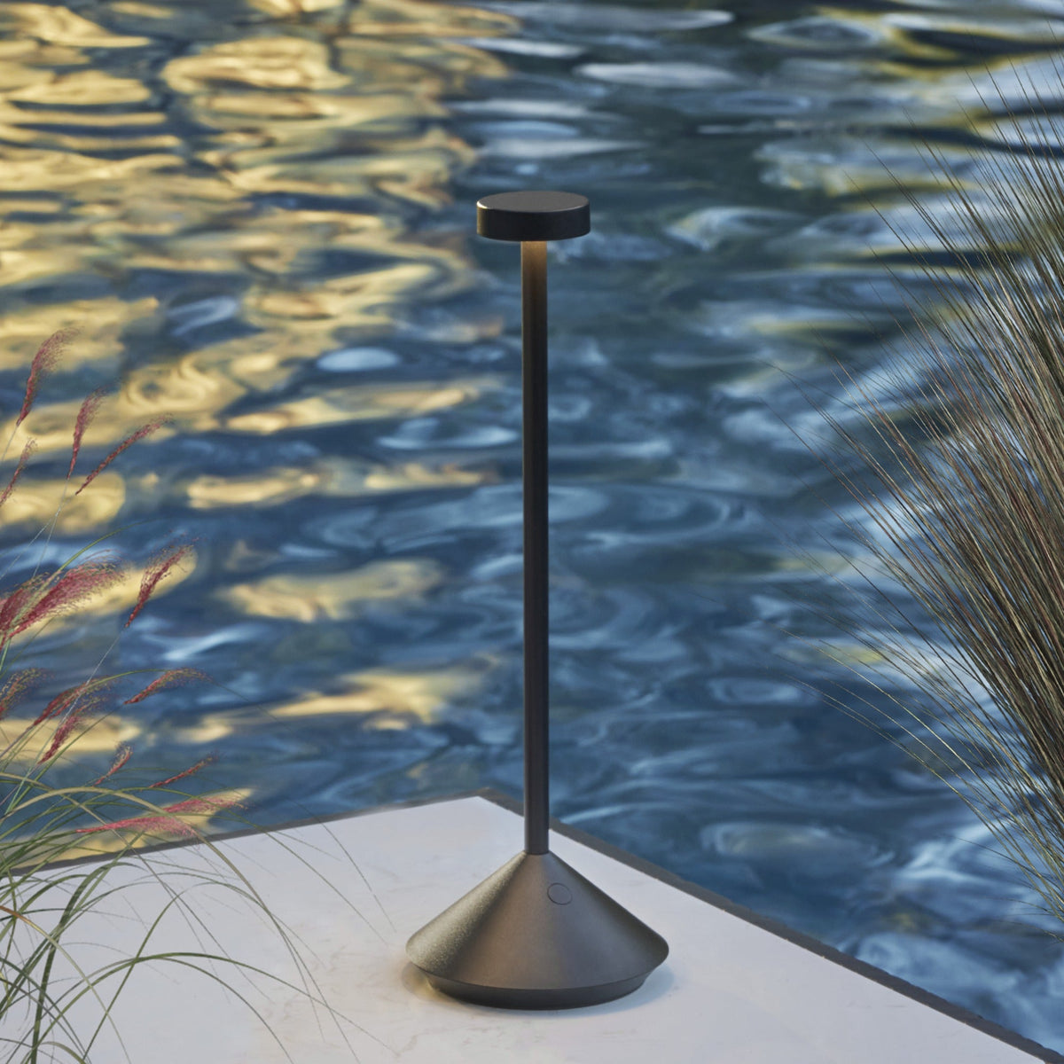 Moneta Accent lamp casting a pool of light on a table