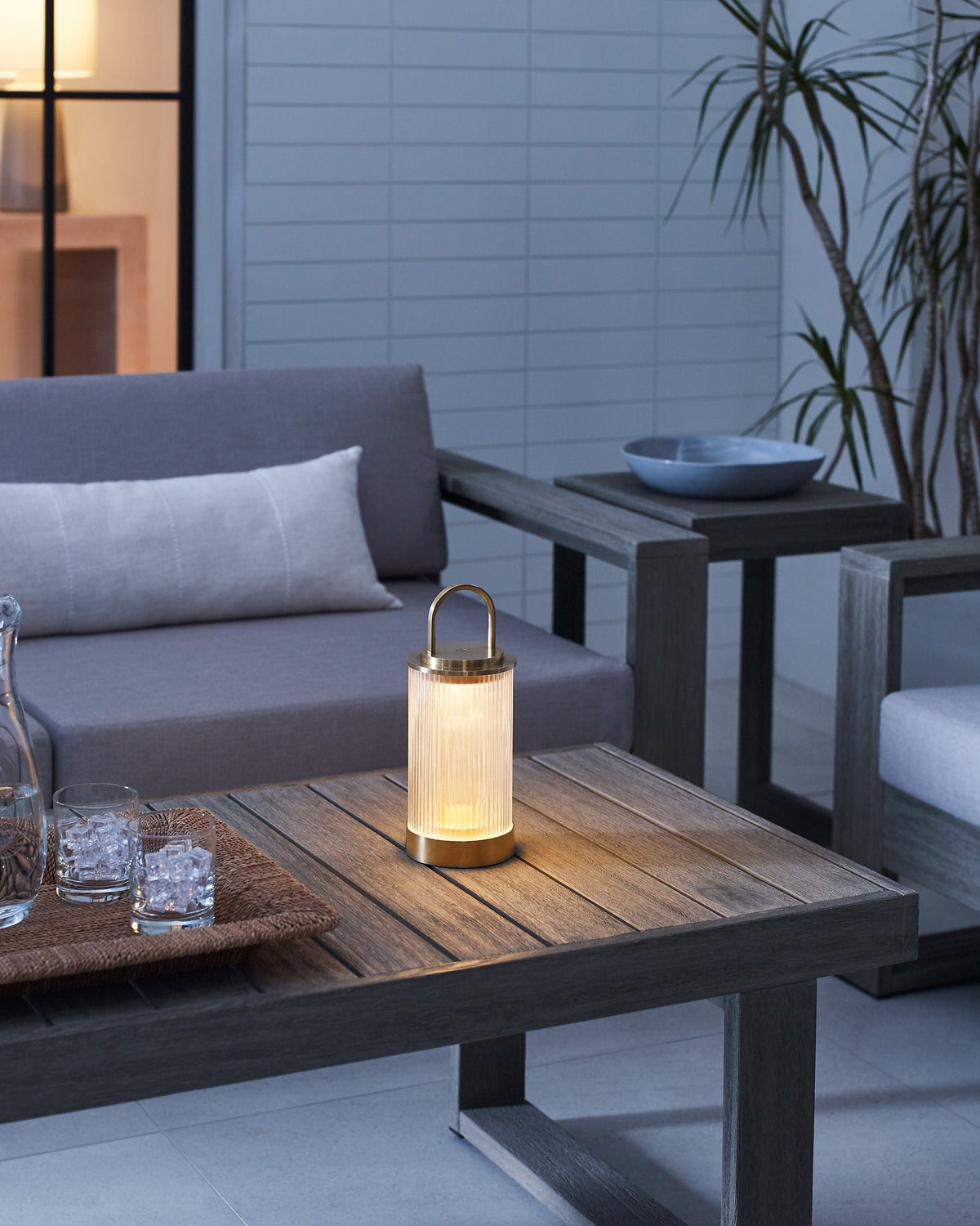 Tawa Accent table lamp in Natural Brass, lit