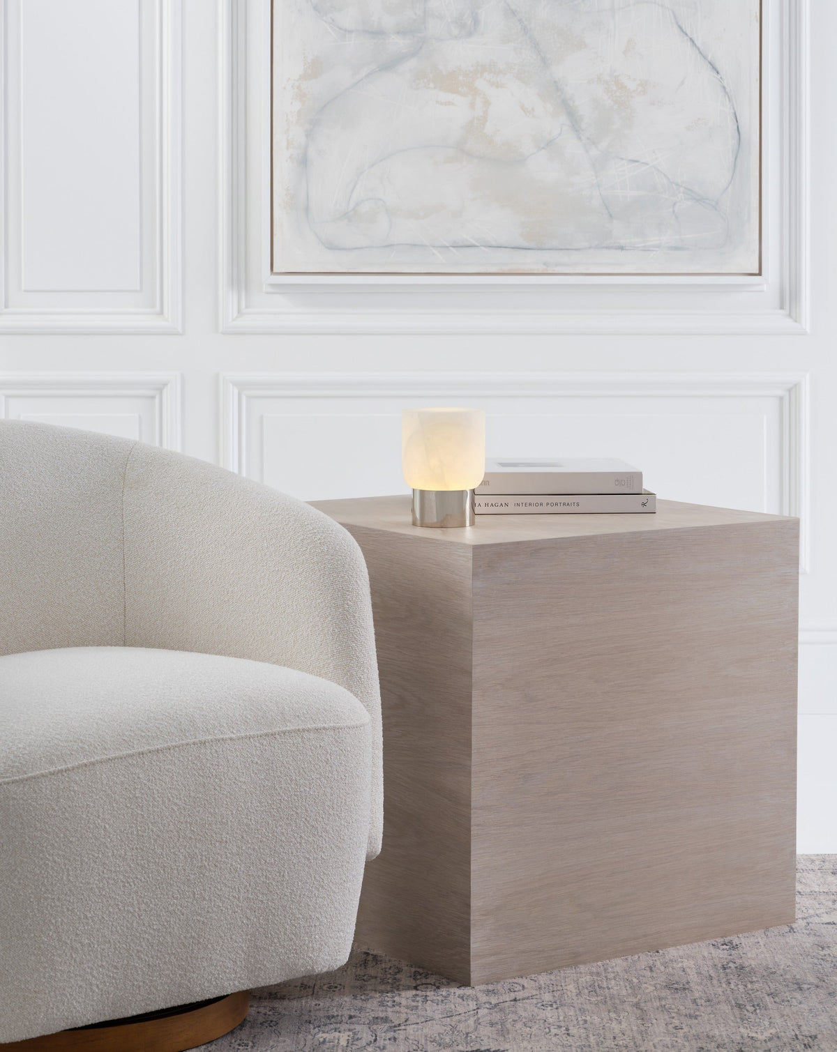 Caspe Alabaster 7 lamp in Polished Nickel glowing on a table