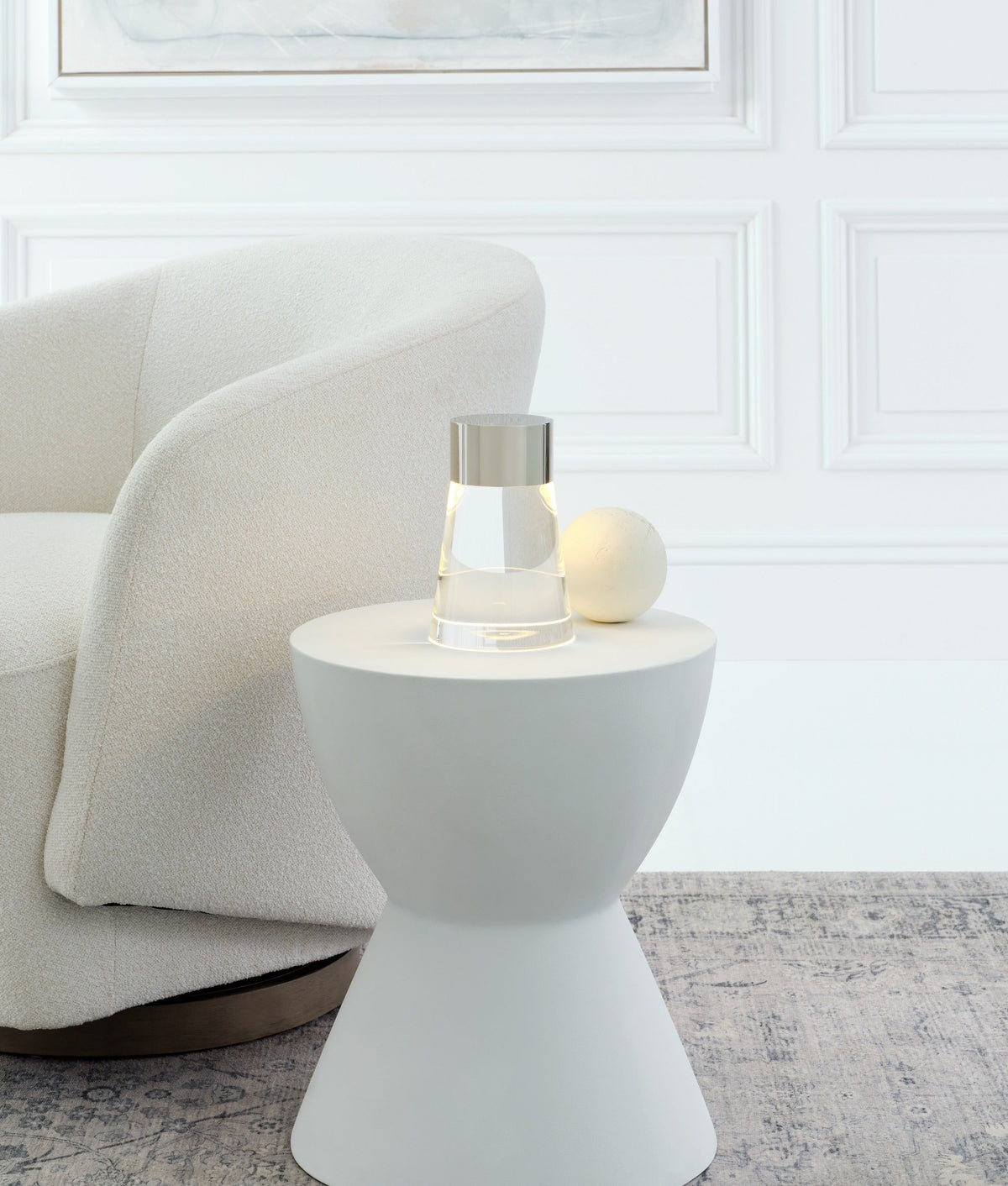 Caspe 8 cordless crystal lamp in Polished Nickel glowing on a table