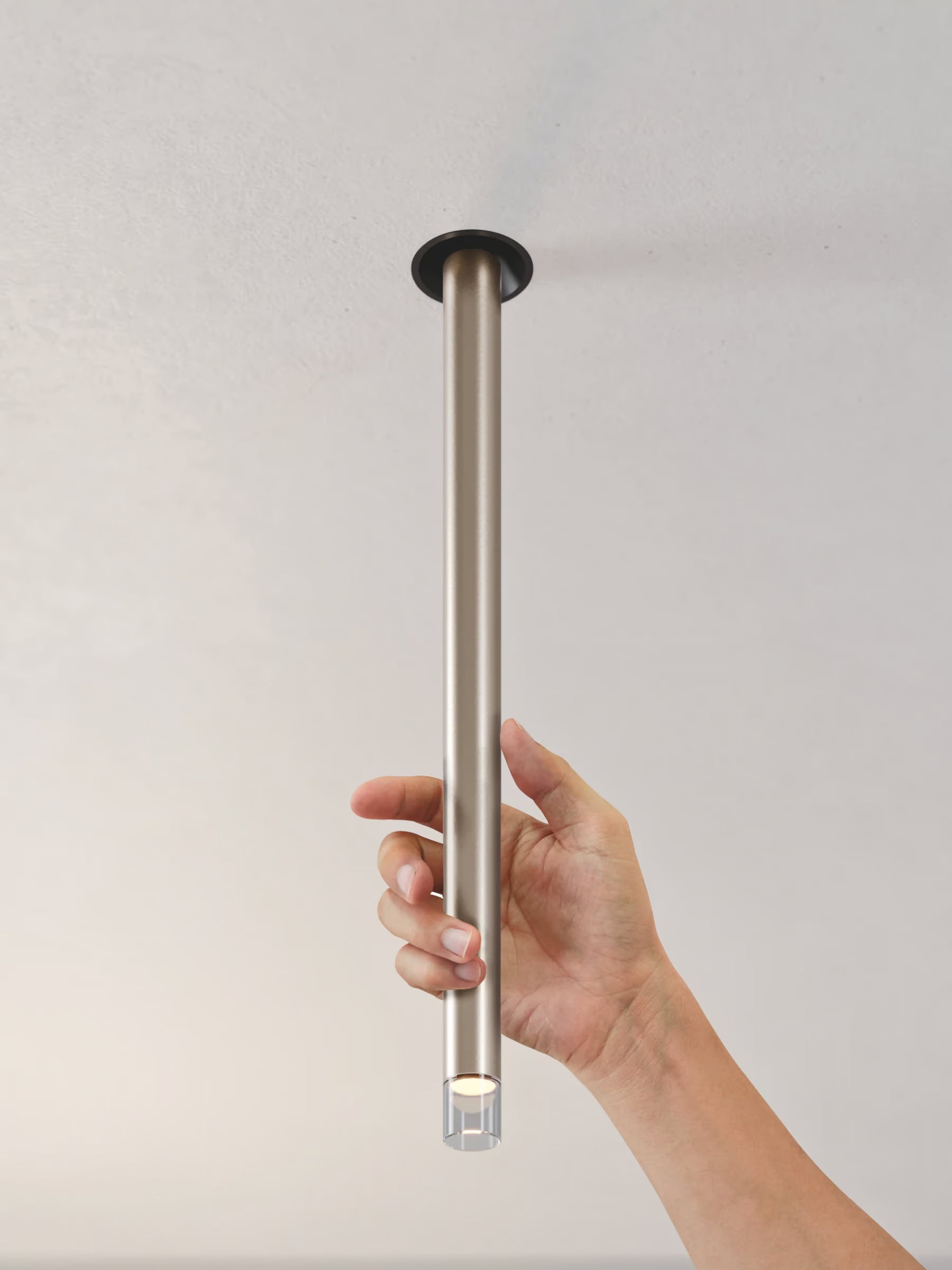Lodes Italy A-Tube Nano Swing recessed ceiling light illuminating a dining area