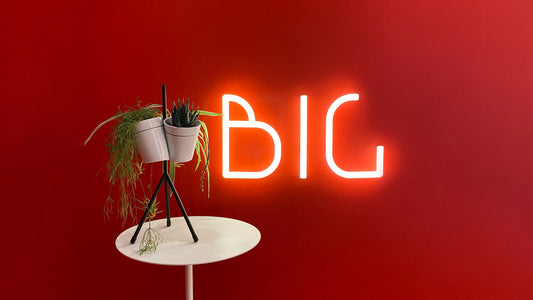 Artemide Alphabet Of Light Mini Letters Wall Light in a room setting