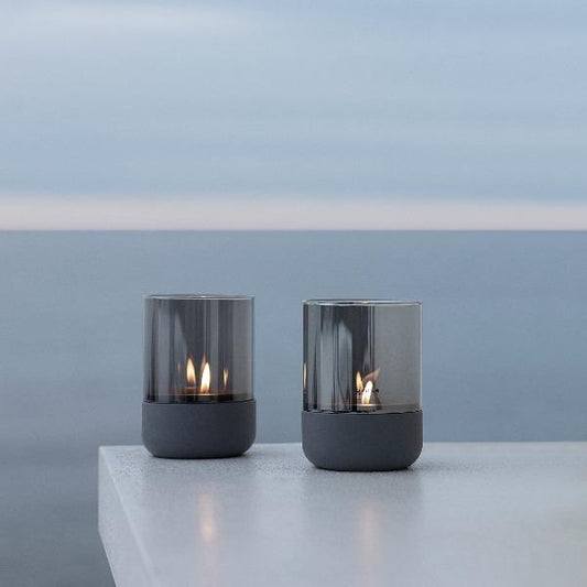 blomus CALMA Tealight Hurricane, Concrete & Clear Glass – CALMA tealight hurricane on a terrace (1)