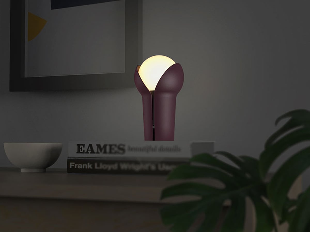 Innermost Bud rechargeable table lamp by Melissa Yip – Aubergine on a desk at night