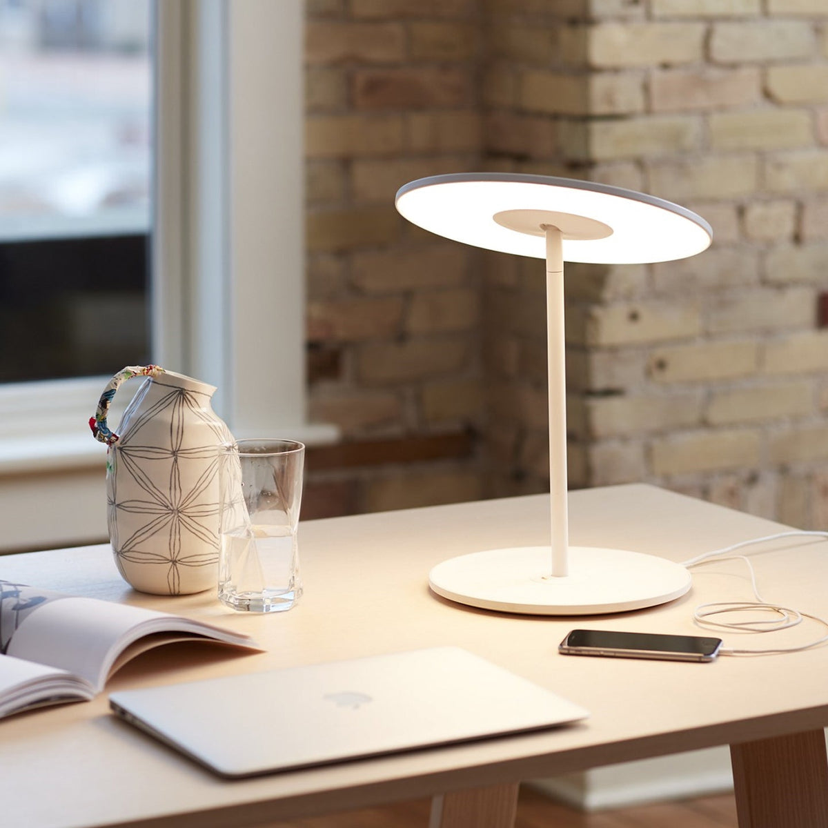 Circa lamp at a workstation, wide environmental view