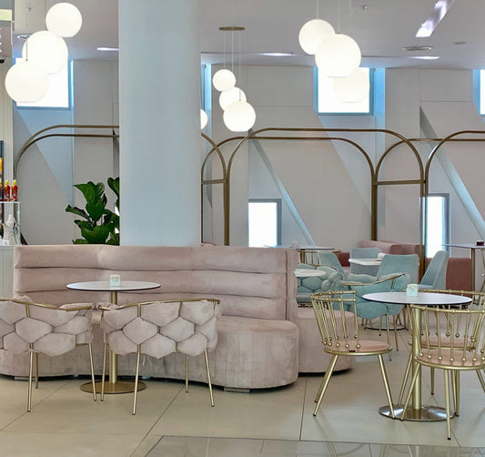 Besa Coco opal globe pendants installed over restaurant tables