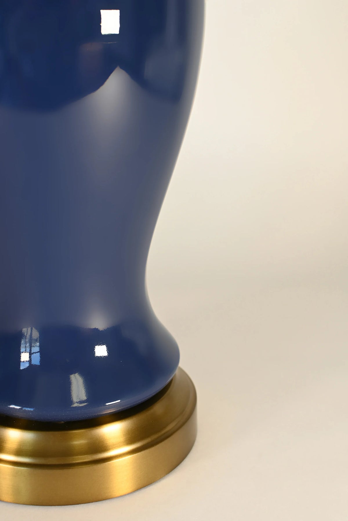 Midnight blue ceramic Elijah lamp with antique brass base detail