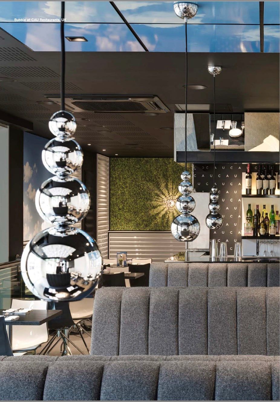 Reflective mini pendant light with sculptural stainless steel design for ambient lighting for restaurants and hospitality projects