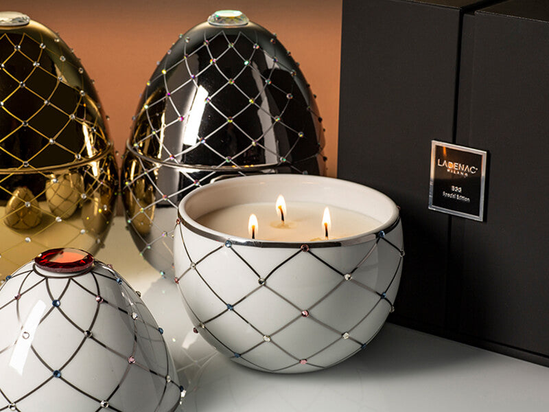 Bois de Russie 450 g ceramic egg candle by Ladenac Milano, White Silver Stripes egg opened beside its gift box