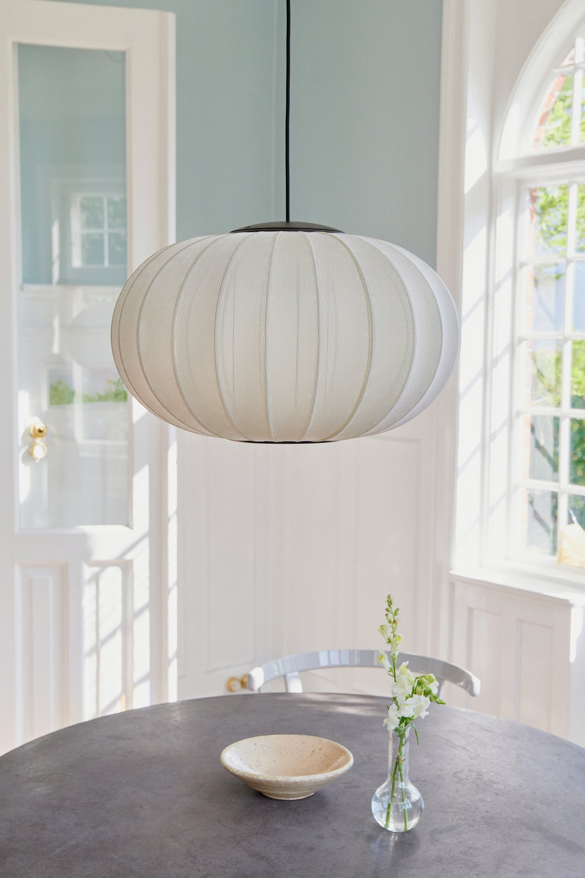 Knit-Wit Oval 57 LED Pendant in pearl white, shown in an interior (80)